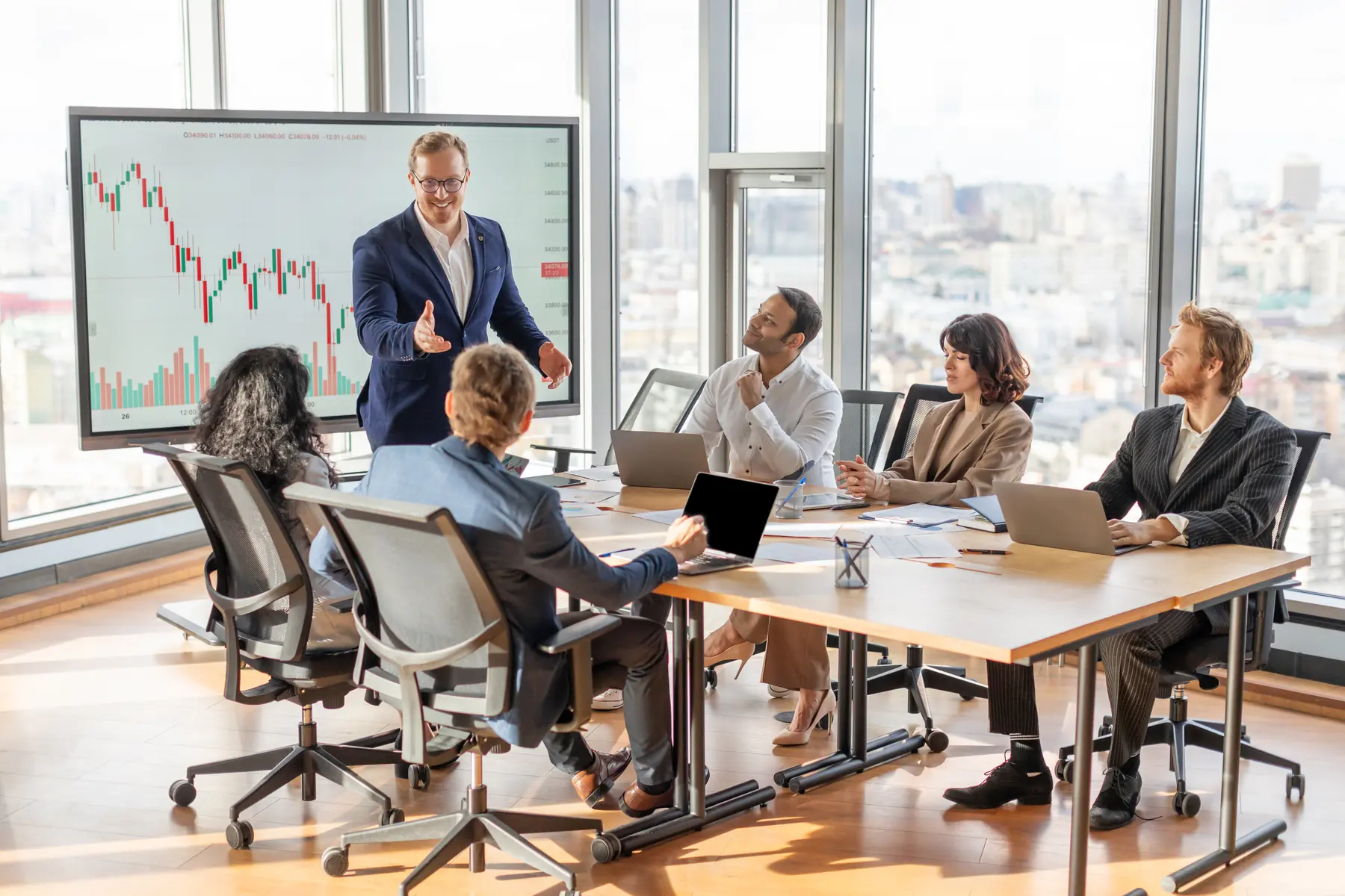 Business professionals sharing news and ideas during an office meeting